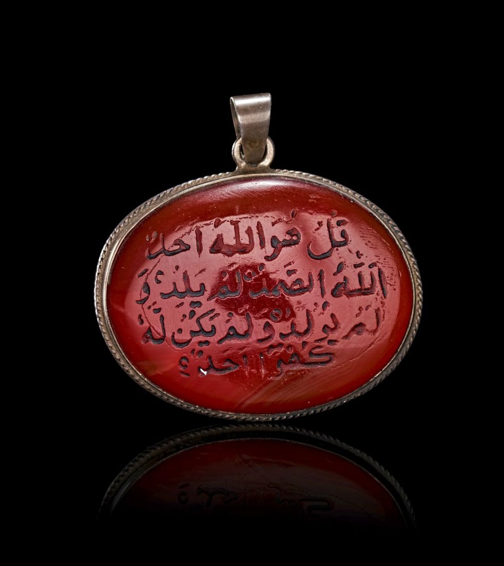 A CALLIGRAPHIC INSCRIBED CARNELIAN AMULET, 19TH CENTURY, PERSIA (1 of 2)