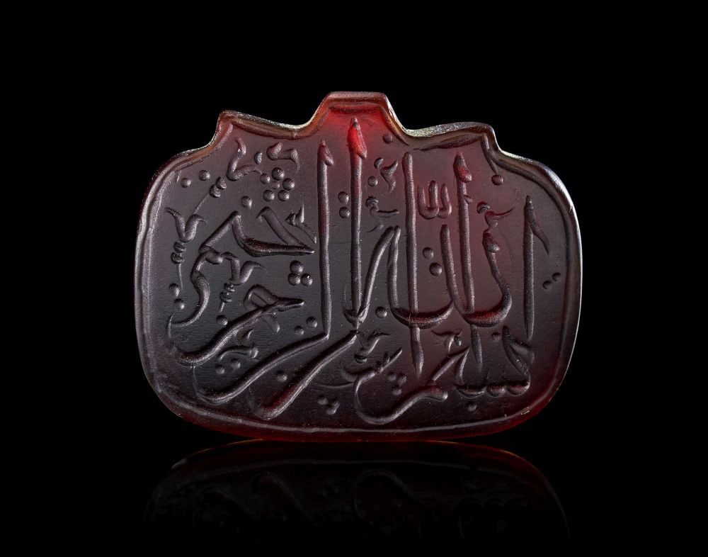 A CALLIGRAPHIC INSCRIBED AGATE AMULET, 19TH CENTURY, PERSIA (1 of 2)