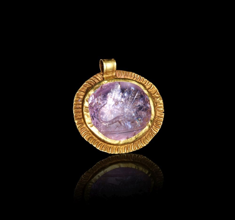 A LATE ROMAN INSCRIBED MAGICAL GEM: WINGED CHNOUBIS-TYPE DAIMON, CIRCA 2ND-4TH CENTURY A.D.: A LATE ROMAN INSCRIBED MAGICAL GEM: WINGED CHNOUBIS-TYPE DAIMON, CIRCA 2ND-4TH CENTURY A.D. A Late Roman inscribed magical gem depicting a winged Chnoubis-type daimon, dating to circa 2nd-4th century 