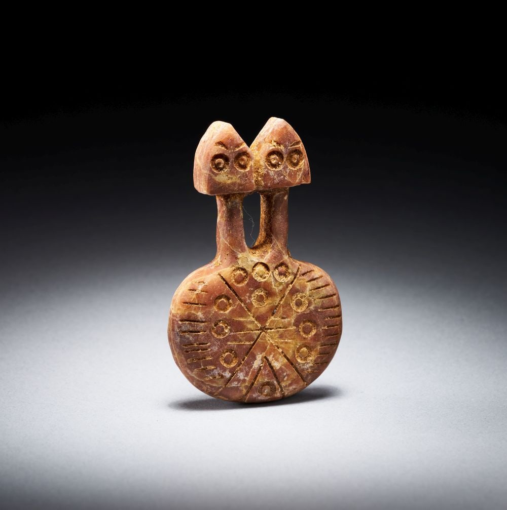 AN ANATOLIAN MARBLE TWO-HEADED IDOL CIRCA LATE 3RD MILLENNIUM B.C. (1 of 4)