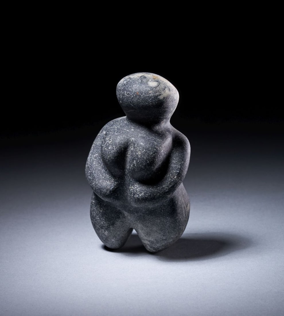 A NEOLITHIC BLACK STONE MOTHER GODDESS IDOL, CIRCA 6TH MILLENNIUM B.C.: A NEOLITHIC BLACK STONE MOTHER GODDESS IDOL, CIRCA 6TH MILLENNIUM B.C. Height: 12cm Provenance: Important Poland Collection, Up To 2015. By Decent By The Previous Family Collection, Poland-Greece. Imp