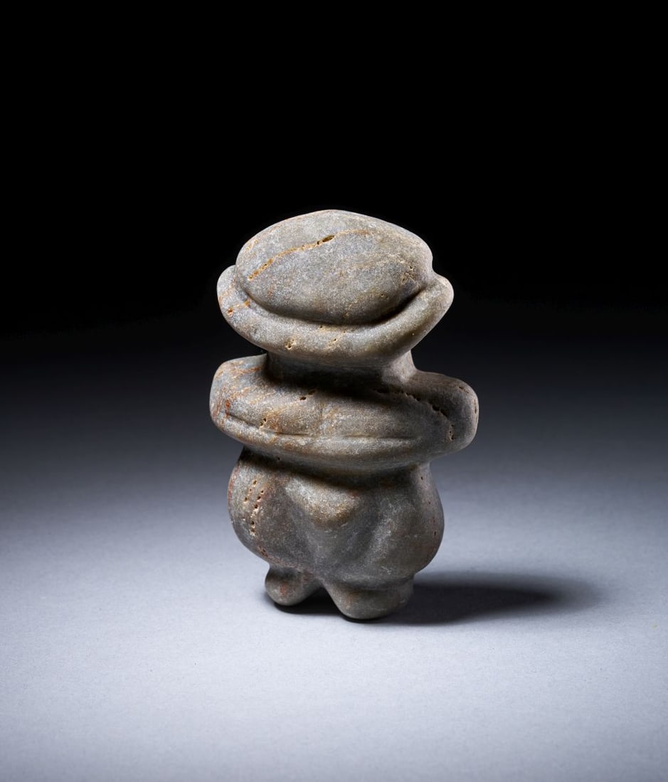 A NEOLITHIC BLACK STONE MOTHER GODDESS IDOL, CIRCA 6TH MILLENNIUM B.C.: A NEOLITHIC BLACK STONE MOTHER GODDESS IDOL, CIRCA 6TH MILLENNIUM B.C. Height: 9.6cm Provenance: Important Poland Collection, Up To 2015. By Decent By The Previous Family Collection, Poland-Gree