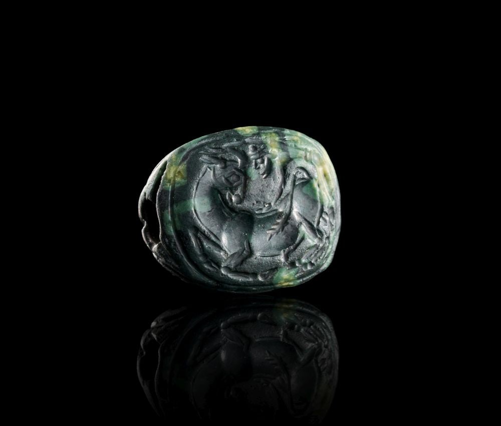 A EXCEPTIONAL MINOAN GREEN CHALCEDONY THREE DIMENSIONAL SEAL DEPICTING SEAL CREATURES, LATE PALACE P (1 of 3)