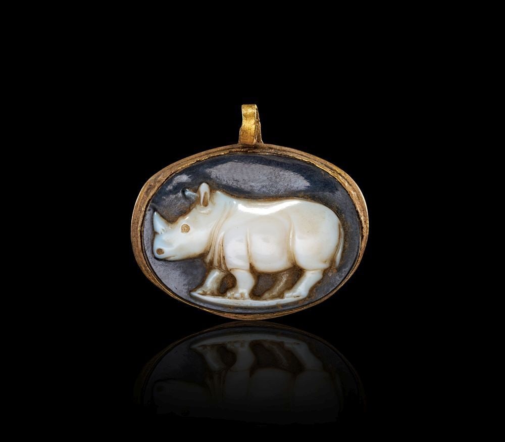 A ROMAN SARDONYX CAMEO OF A RHINOCEROS Circa 1st Century A.D.: A ROMAN SARDONYX CAMEO OF A RHINOCEROS Circa 1st Century A.D. A finely carved Roman sardonyx cameo d