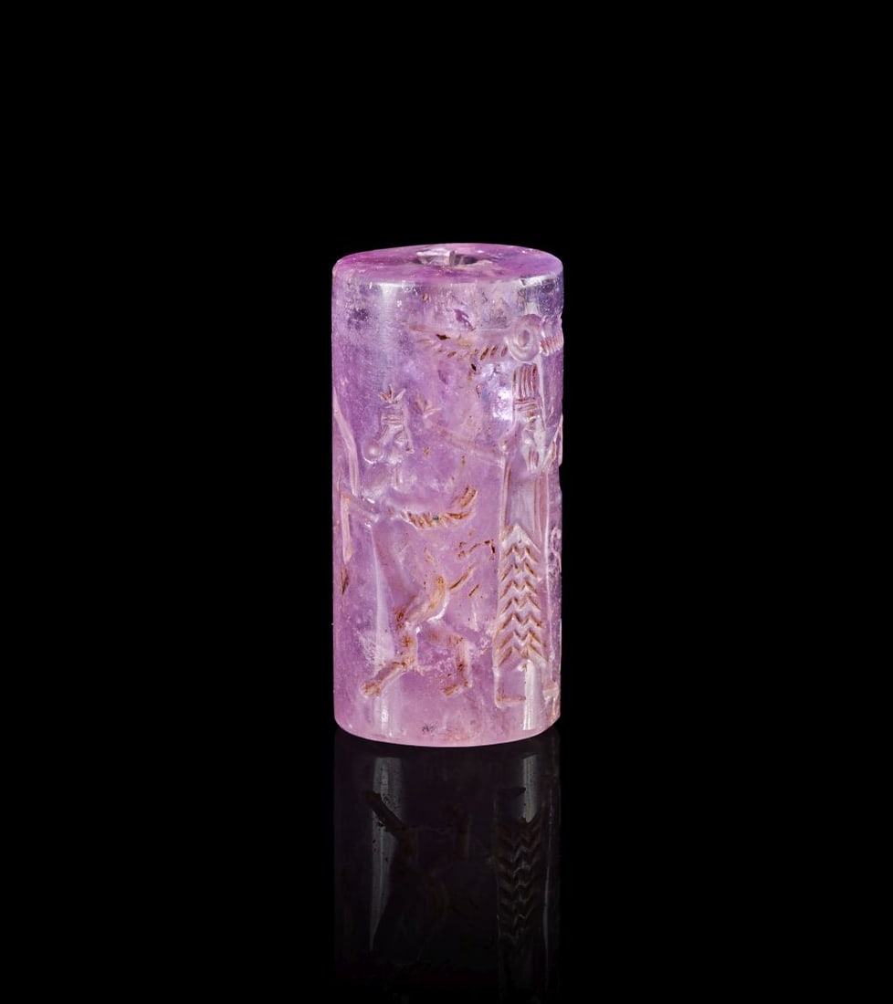 A NEO-BABYLONIAN AMETHYST CYLINDER SEAL CIRCA 900-700 B.C. (1 of 3)