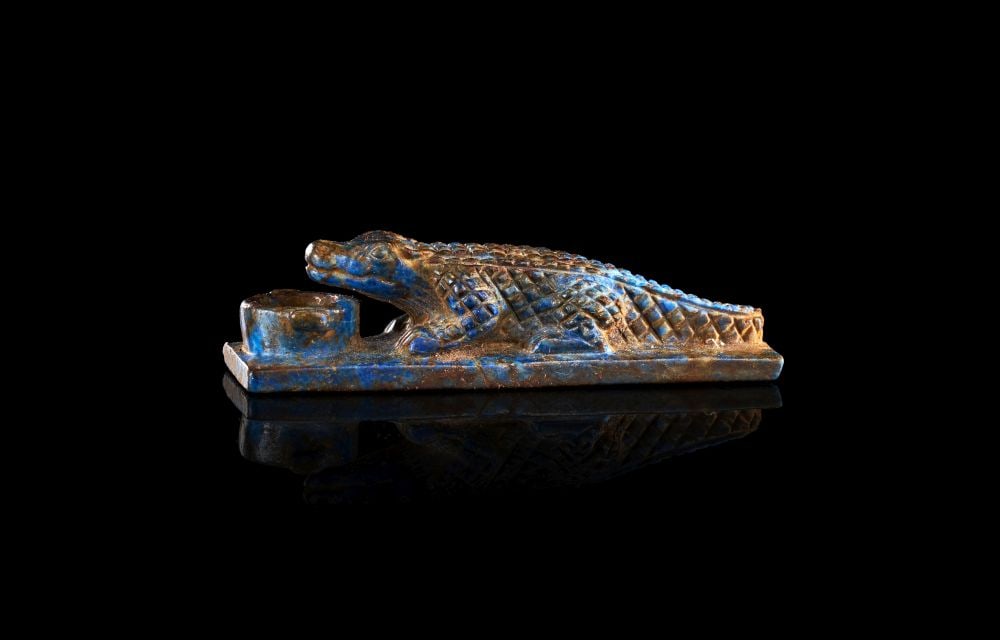 AN EGYPTIAN LAPIS LAZULI CROCADILE AMULET, LATE PERIOD, 664-332 B.C. (1 of 5)