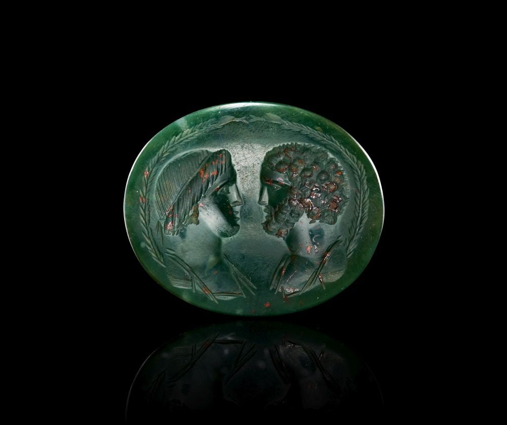 A ROMAN BLOODSTONE INTAGLIO DEPICTING TWO LOVERS, CIRCA 2ND-3RD CENTURY A.D. (1 of 1)