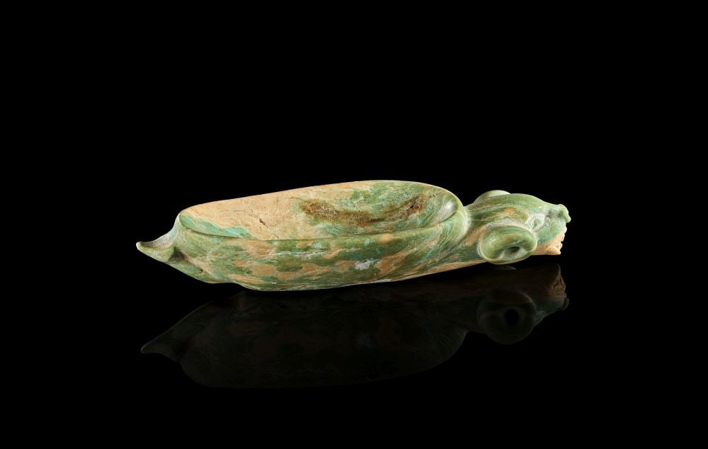 AN EXCEEDINGLY RARE NEAR EASTERN JADE MEDICINAL VESSEL (SPOON) LATE 3RD-2ND MILLENNIUM B.C.: AN EXCEEDINGLY RARE NEAR EASTERN JADE MEDICINAL VESSEL (SPOON) LATE 3RD-2ND MILLENNIUM B.C. An exceedingly rare Near Eastern jade medicinal vessel or spoon, carved in elongated zoomorphic form. The bo