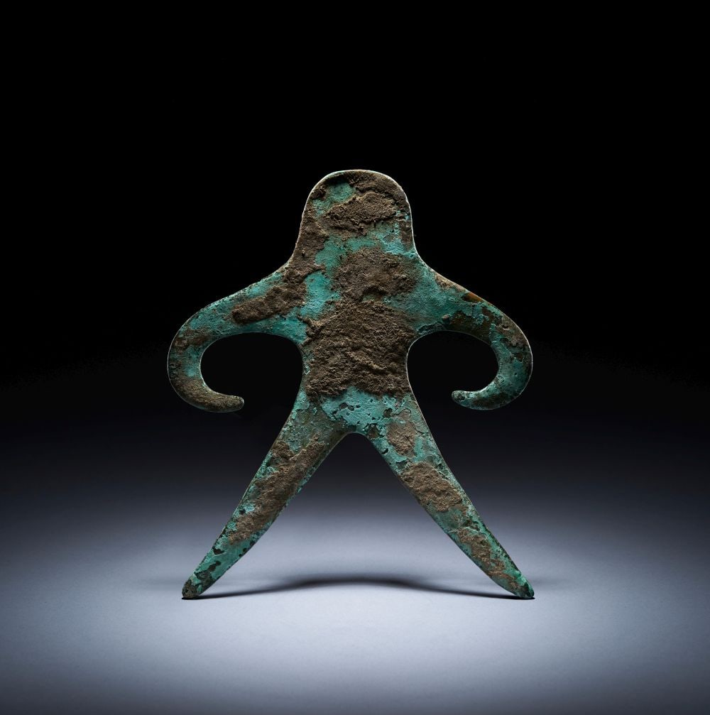 A BRONZE ANTHROPOMORPHIC FIGURE INDIA, GANGETIC PLAINS, 2ND MILLENIUM BCE (1 of 3)