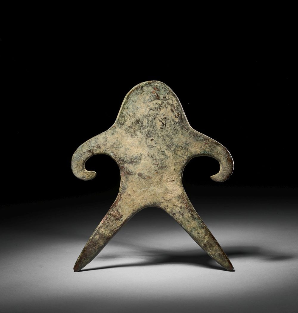 A BRONZE ANTHROPOMORPHIC FIGURE INDIA, GANGETIC PLAINS, 2ND MILLENIUM BCE (1 of 3)