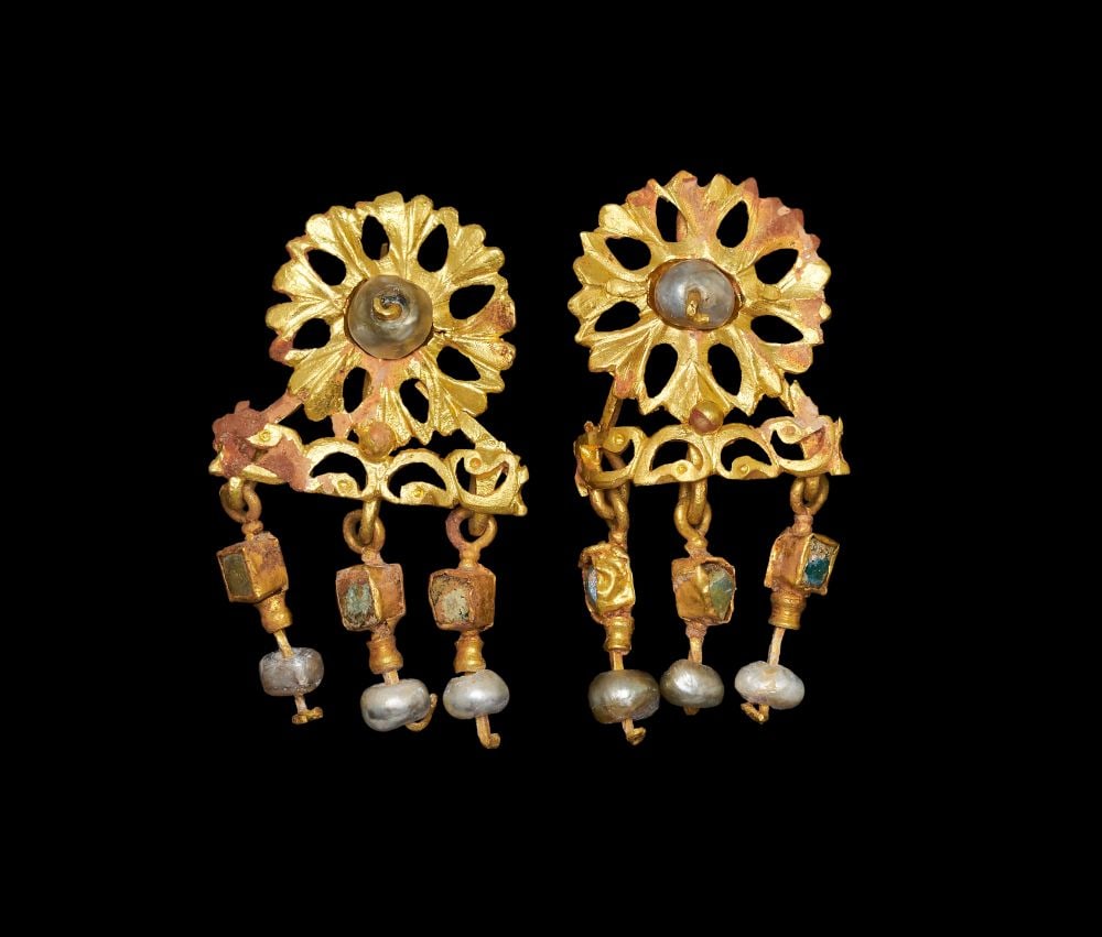 A PAIR OF ROMAN GOLD OPENWORK EARRINGS WITH GLASS & PEARLS PENDANTS, EASTERN MEDITERRANEAN, LATE 1ST: A PAIR OF ROMAN GOLD OPENWORK EARRINGS WITH GLASS & PEARLS PENDANTS, EASTERN MEDITERRANEAN, LATE 1ST Formed in high-karat gold, this pair of earrings is designed as openwork repoussé rosett
