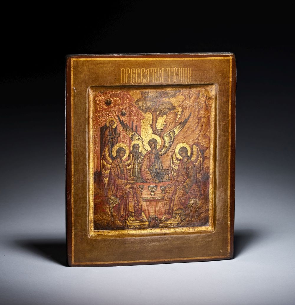 A RUSSIAN ICON DEPICTING TRINITY IN KOVCHEG, 18TH CENTURY: A RUSSIAN ICON DEPICTING TRINITY IN KOVCHEG, 18TH CENTURY Painted on panel within a recessed kovcheg, this Russian icon depicts the Old Testament Trinity, one of the most enduring subjects of Orthodox