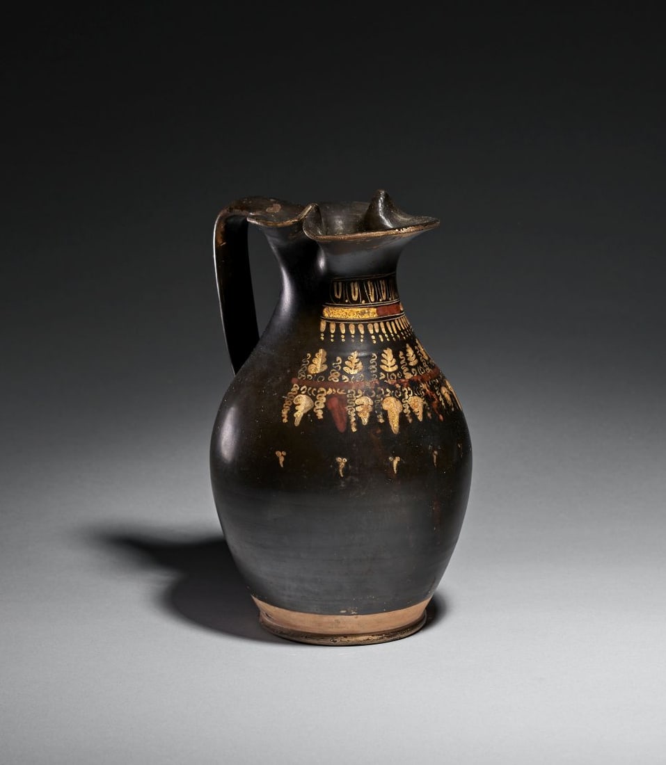 A TERRACOTTA OINOCHOE (JUG) GREEK, SOUTHERN ITALY, GNATHIAN, CIRCA 325–300 BCE (1 of 7)