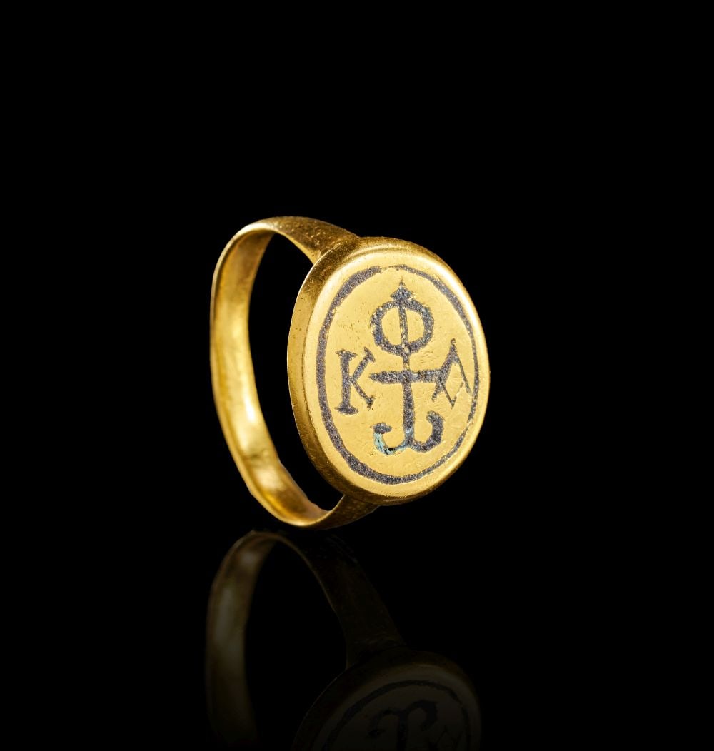 A BYZANTINE GOLD & NIELLO INSCRIBED MONOGRAM RING, CIRCA 9TH CENTURY A.D. (1 of 3)