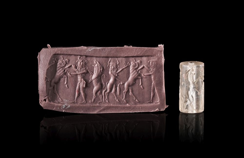 AN ACHAEMENID ROCK CRYSTAL CYLINDER SEAL CIRCA LATE 6TH CENTURY B.C. (1 of 3)