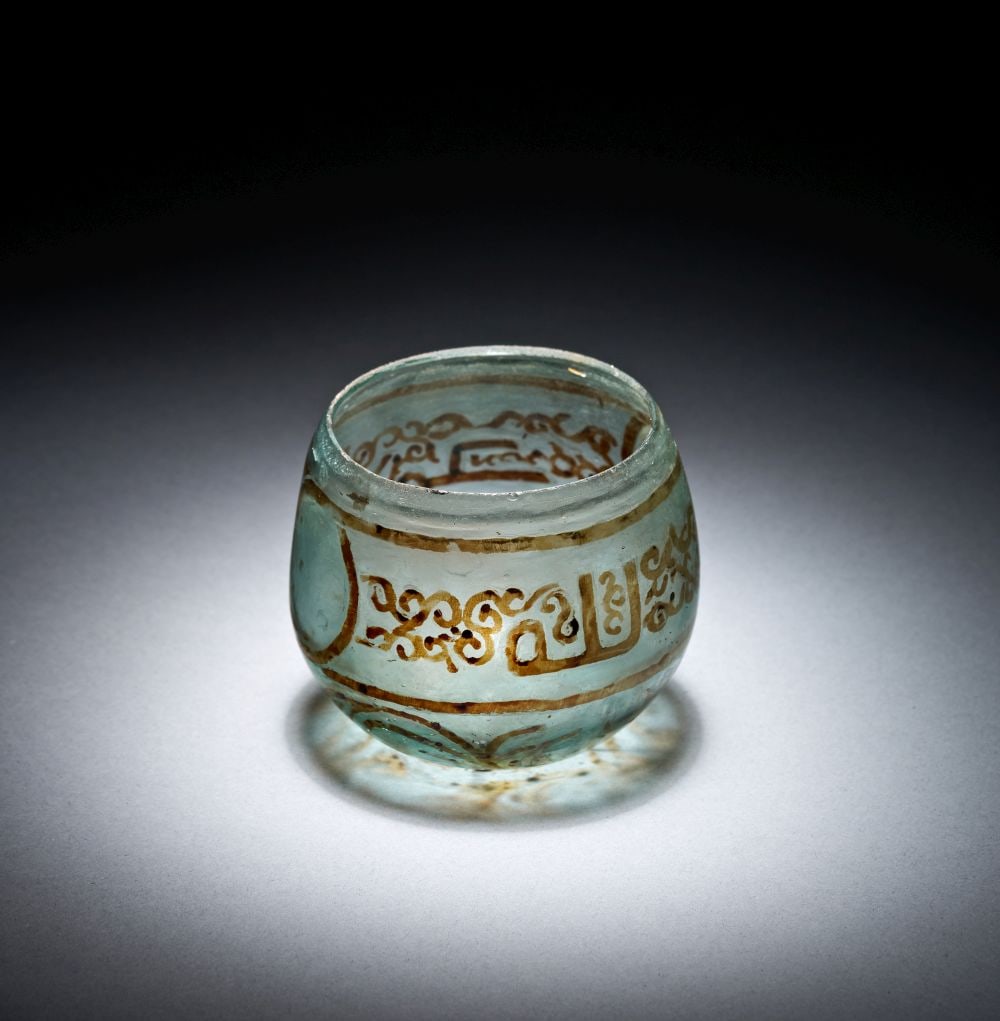 A FATIMID LUSTRE-DECORATED GLASS CUP, SYRIA, 9TH-11TH CENTURY (1 of 4)