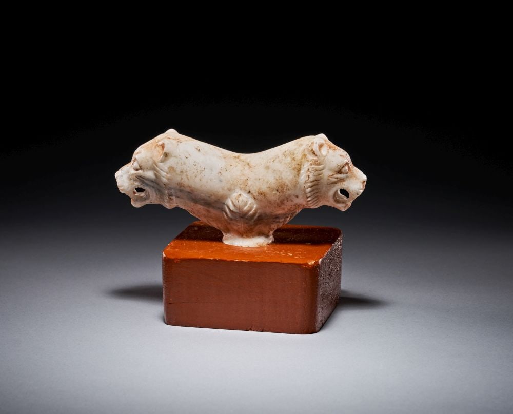 A MESOPOTAMIAN MARBLE DOUBLE-HEADED LION STAFF HEAD, CIRCA 3300–2900 B.C. OR LATER (1 of 4)
