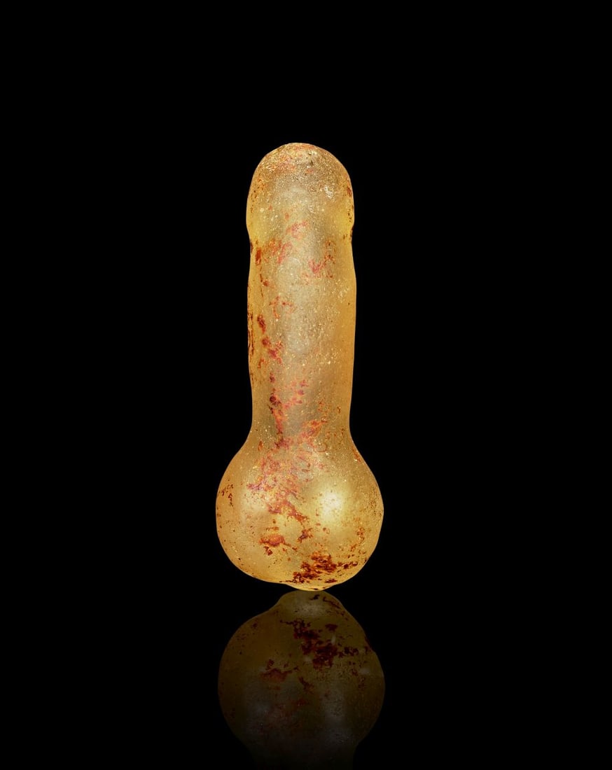 A GREEK ROCK CRYSTAL PHALLUS AMULET, CIRCA 2ND-3RD CENTURY A.D.: A GREEK ROCK CRYSTAL PHALLUS AMULET, CIRCA 2ND-3RD CENTURY A.D. Carved from rock crystal, this small amulet is formed as a phallus with a softly rounded terminal and a gently tapering shaft. The trans