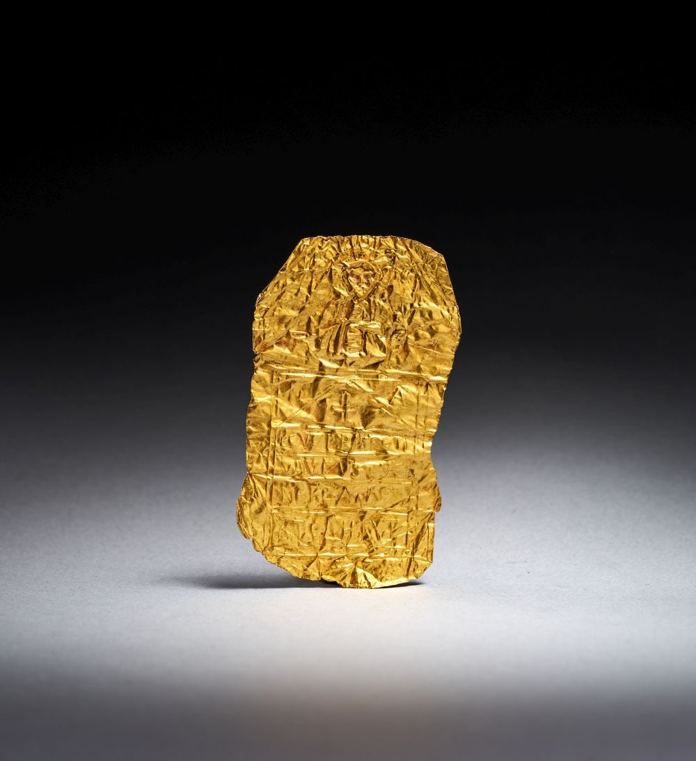 A LATE BYZANTINE OR MEDIEVAL GOLD SHEET DEPICTING CHRIST WITH INSCRIPTIONS, CIRCA 12TH-15TH CENTURY: A LATE BYZANTINE OR MEDIEVAL GOLD SHEET DEPICTING CHRIST WITH INSCRIPTIONS, CIRCA 12TH-15TH CENTURY Worked from a thin sheet of gold, this devotional plaque is of irregular rectangular form, its surfa