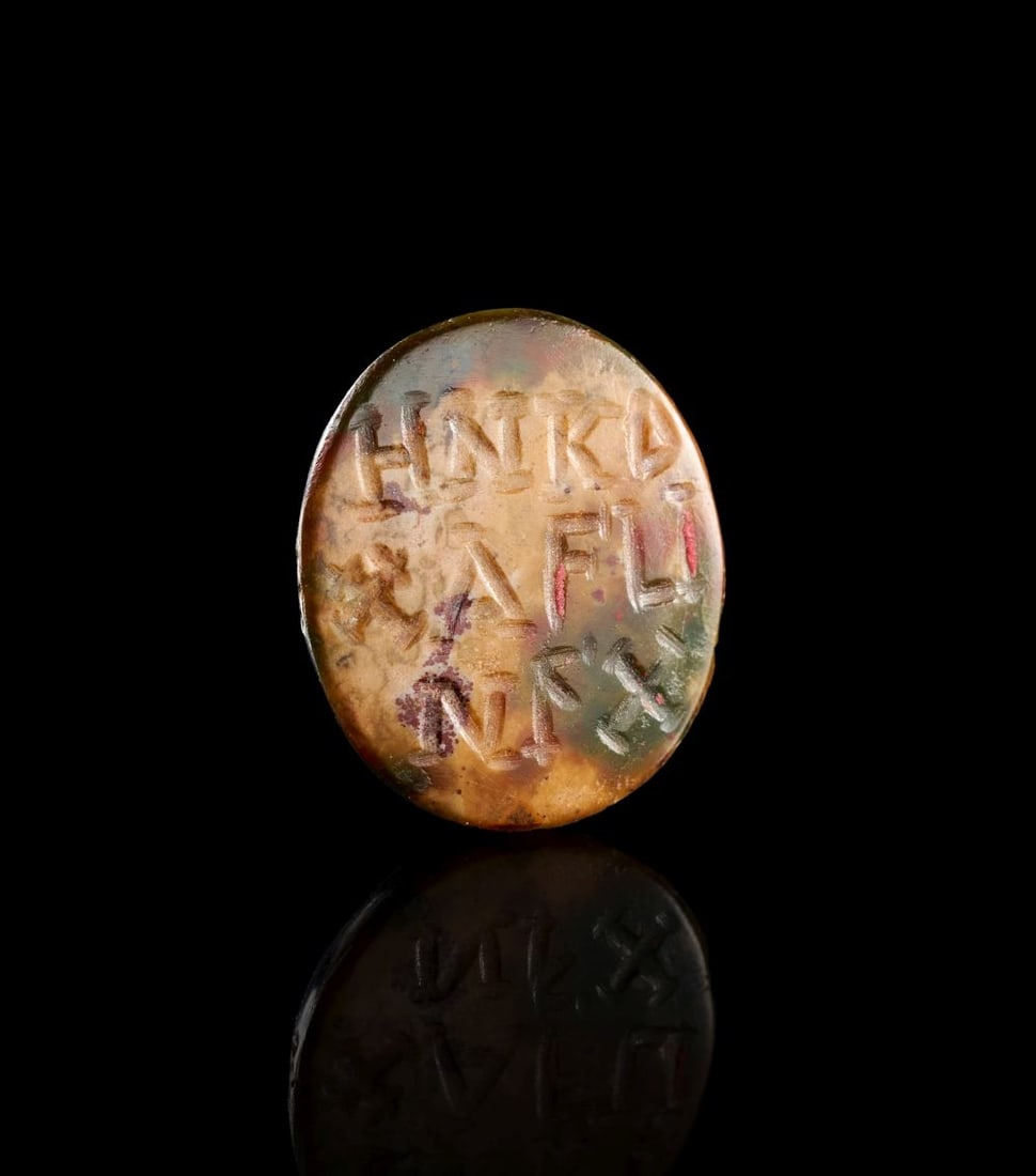 A GNOSTIC GREEK INSCRIBED GREEN JASPER INTAGLIO, CIRCA 3RD-4TH CENTURY A.D.: A GNOSTIC GREEK INSCRIBED GREEN JASPER INTAGLIO, CIRCA 3RD-4TH CENTURY A.D. The green jasper intaglio is of oval form, its polished surface cut with a short Greek inscription arranged across the face 