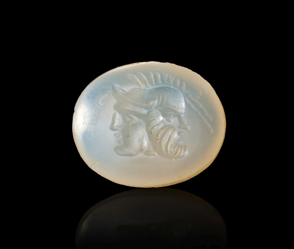 A ROMAN CHALCEDONY INTAGLIO COMPOSED OF HEADS OF SILENUS AND MINERVA, CIRCA: 1ST-2ND CENTURY A.D. (1 of 1)