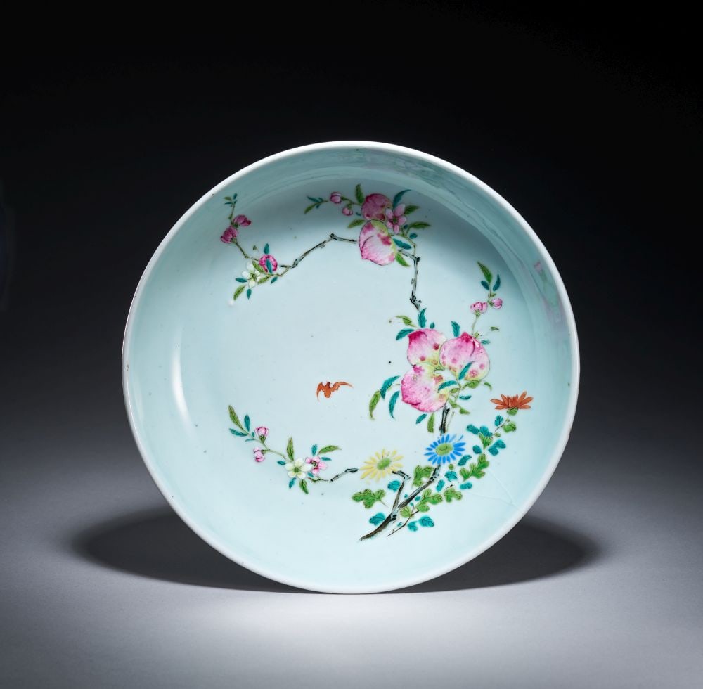A CHINESECELADON GLAZED DISH, QIANLONG (1736-1795): A CHINESECELADON GLAZED DISH, QIANLONG (1736-1795) The dish is of broad circular form with a shallow well, gently rounded sides and a neatly finished foot, covered in a pale celadon gl