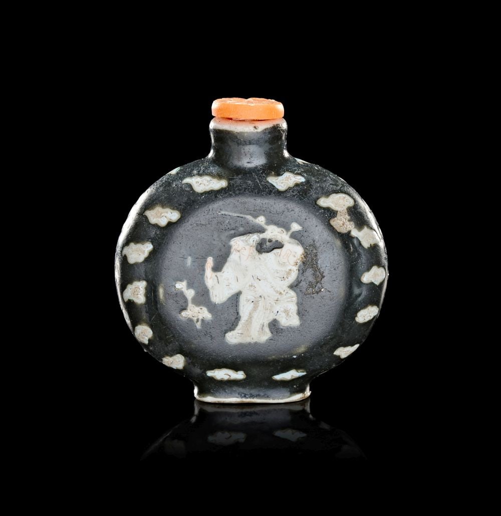 A CHINESE CERAMIC SNUFF BOTTLE DEPICTING A LUOHAN, QING DYNASTY (1644-1911) (1 of 3)