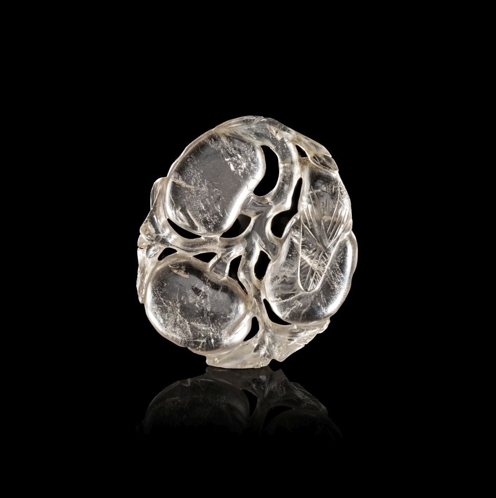 A CHINESE ROCK CRYSTAL "PRUNUS" AMULET, QING DYNASTY (1644-1911) (1 of 2)