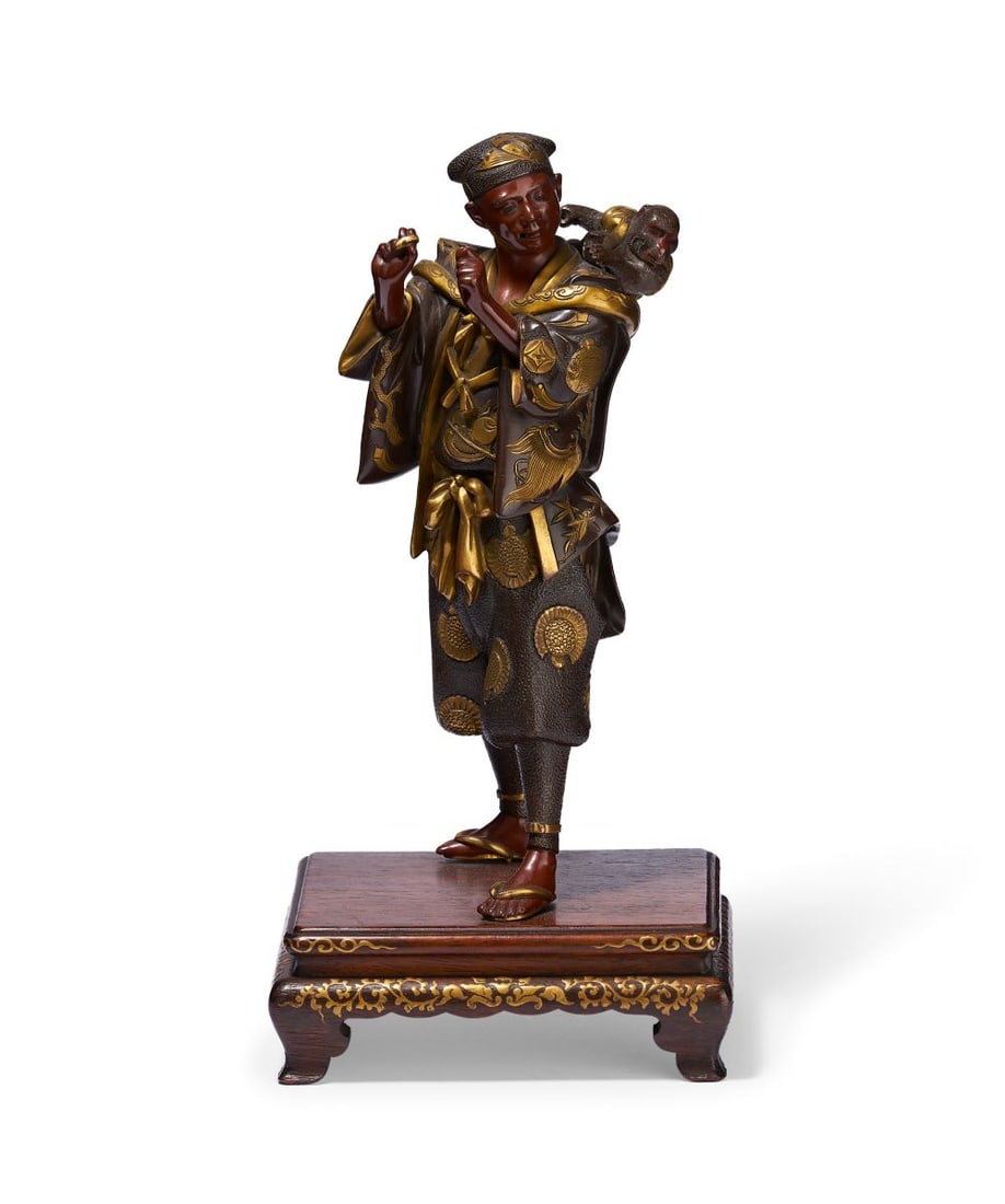 ATTRIBUTED TO MIYAO EISUKE: A GILTDECORATED BRONZE FIGURE OF A MONKEY TAMER, 19TH CENTURY (1 of 7)