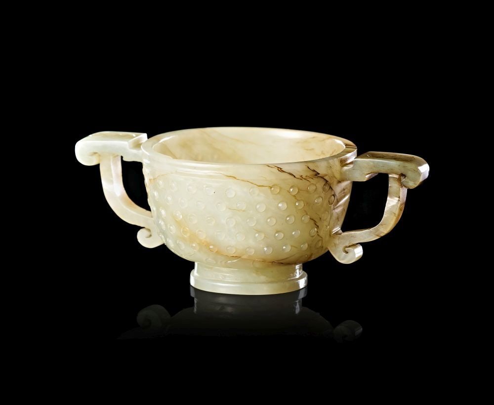 A SMALL CELADON JADE TWIN-HANDLED CUP, CHINA, CIRCA 17TH–18TH CENTURY (1 of 5)