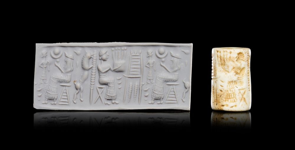 SUMERIAN WHITE STONE CYLINDER SEAL WITH TWO SEATED FIGURES AND ONE FIGURE PLAYING HARP, EARLY (1 of 5)