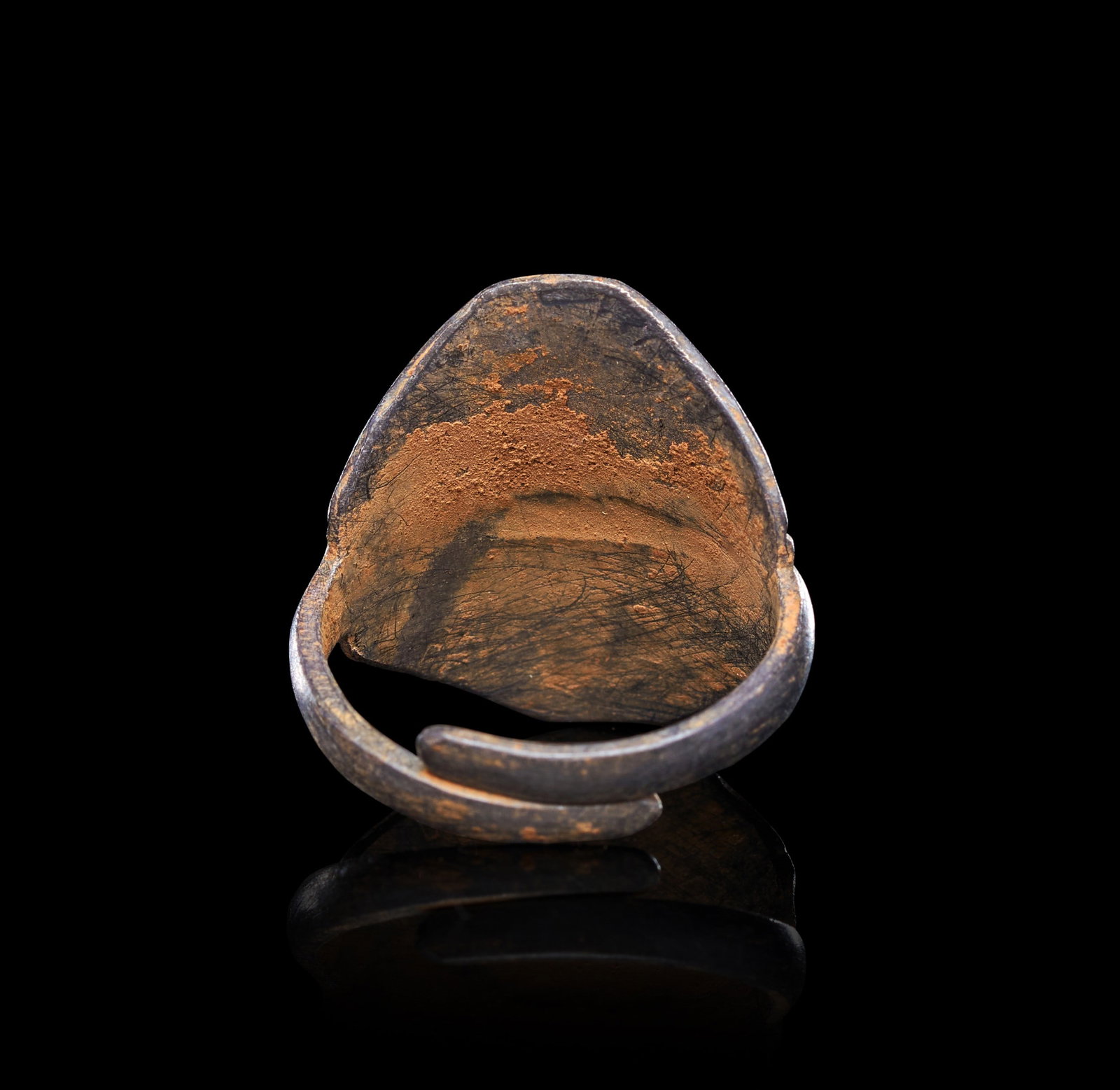 A VIKING SILVER RING, CIRCA 9TH-10TH CENTURY A.D.: A VIKING SILVER RING, CIRCA 9TH-10TH CENTURY A.D.Of flat, lozenge-shaped form, the wide bezel expanding symmetrically from a narrow hoop to two pointed terminals that meet at the centre of the finger.