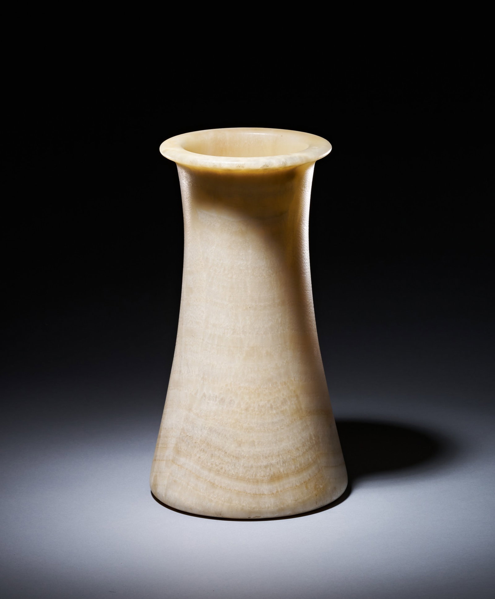 AN EGYPTIAN ALABASTER JAR EARLY DYNASTIC PERIOD, 1ST-3RD DYNASTY, 3000-2613 B.C. (1 of 3)