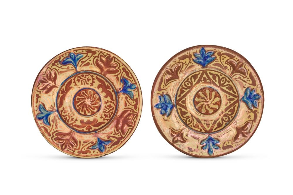A PAIR OF SPANISH HISPANO LUSTRE DISHES: A PAIR OF SPANISH HISPANO-MORESQUE LUSTRE DISHES, VALENCIA, PROBABLY 19TH CENTURY Each of shallow circular form with a raised central boss and a moulded inner well rising to a broad sloping rim, both 