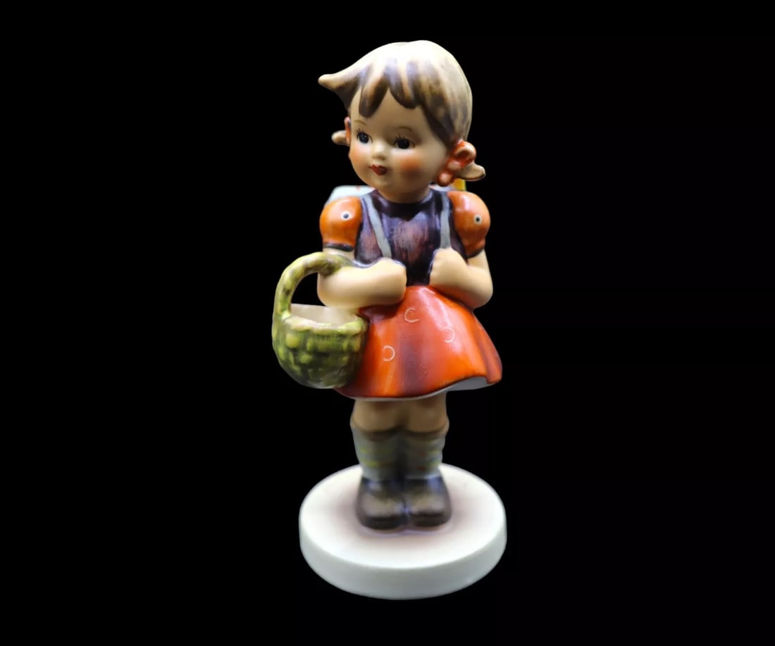Goebel Hummel Porcelain “School Girl” #81/0 Figurine - TMK6: Adorable Goebel Hummel porcelain figurine titled School Girl in great vintage condition with no chips, scratches, crazing or cracks. It features a young boy wearing a top hat and singing in the street