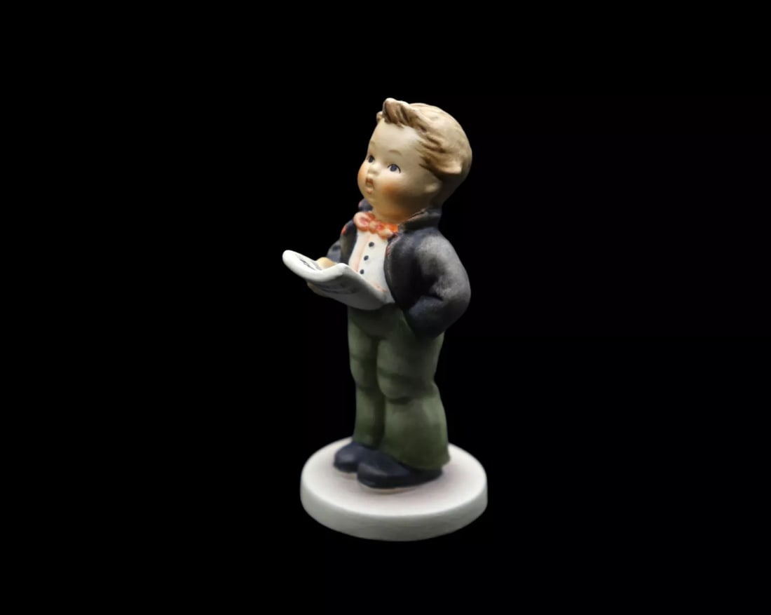 Goebel Hummel Porcelain “Soloist” #135/4/0 Figurine with Original Box - TMK6: Goebel Hummel figurine in the Soloist #135/4/0 pattern. It features a young musician in the act of singing. This piece is in excellent vintage condition with no noticeable damage or chips, no deep scr