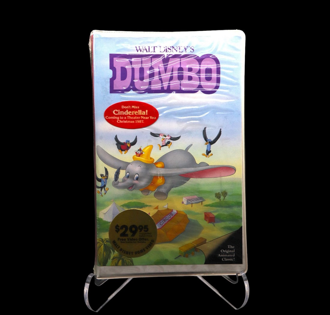 Disney Classic’s Black Diamond Sealed VHS - Dumbo (Cover 2): Sealed Disney Classic’s black diamond VHS of Dumbo (Cover 2 - Dumbo flying with friends). The VHS is unopened and is the original tape. Since the piece is unopened it comes as is and we do not know
