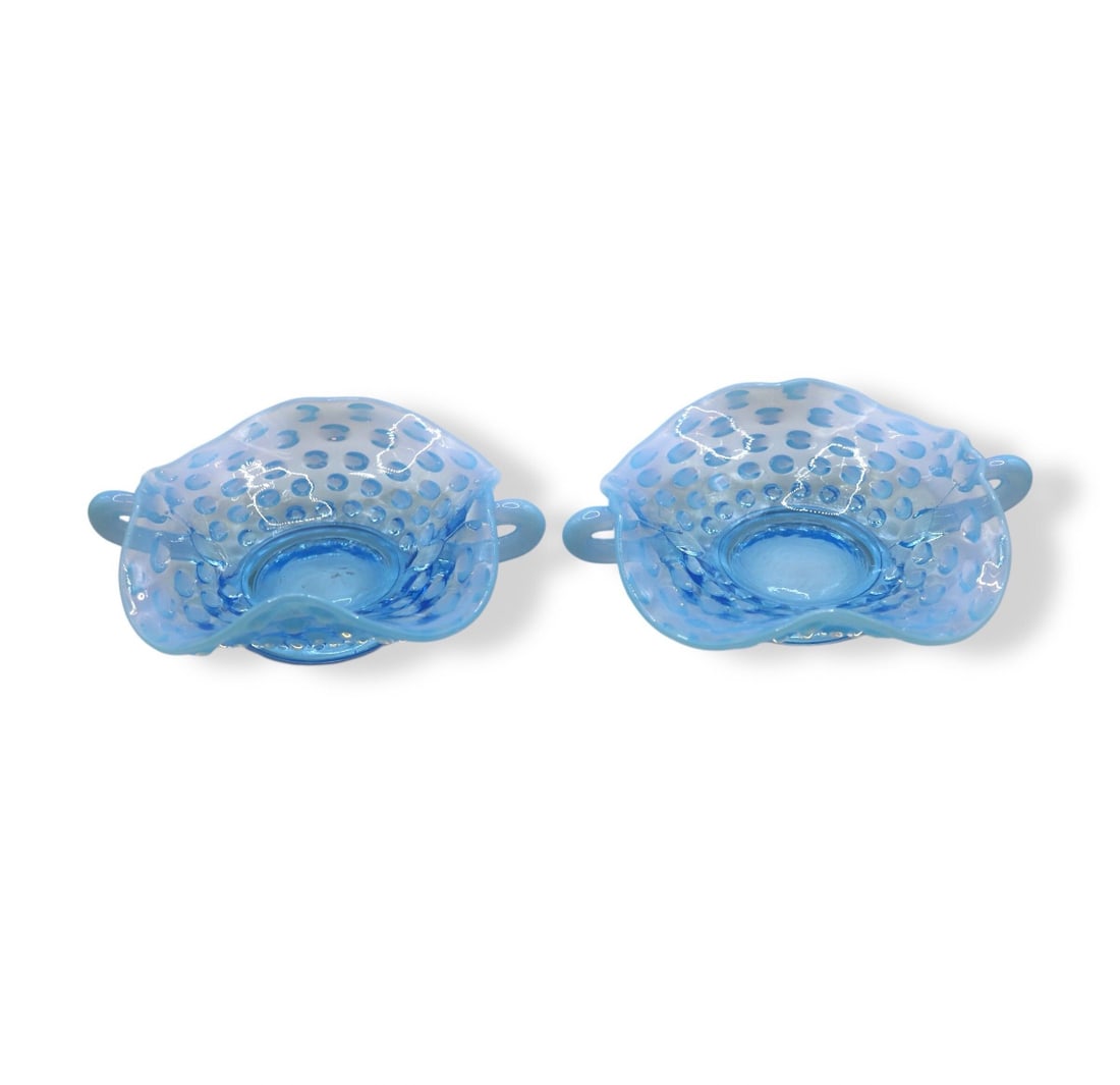 (2) Fenton Art Glass Blue Opalescent Hobnail 4” Handled Bon Bon Bowls: Fenton Art Glass Blue Opalescent Hobnail Bon Bon bowls measuring 4 3/8 inches wide and showcasing the iconic hobnail pattern, complemented by opalescent blue glass that shimmers beautifully in the lig