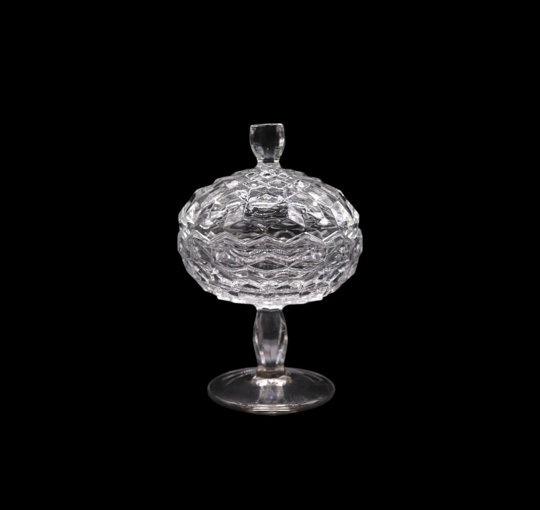 Fostoria “American Clear” Jam / Jelly Pedestal Jar with Lid: Fostoria "American Clear" jam/jelly pedestal jar with lid featuring a timeless geometric design. Standing 6 3/4 inches tall, this vintage glassware is a perfect blend of elegance and functionality. Th
