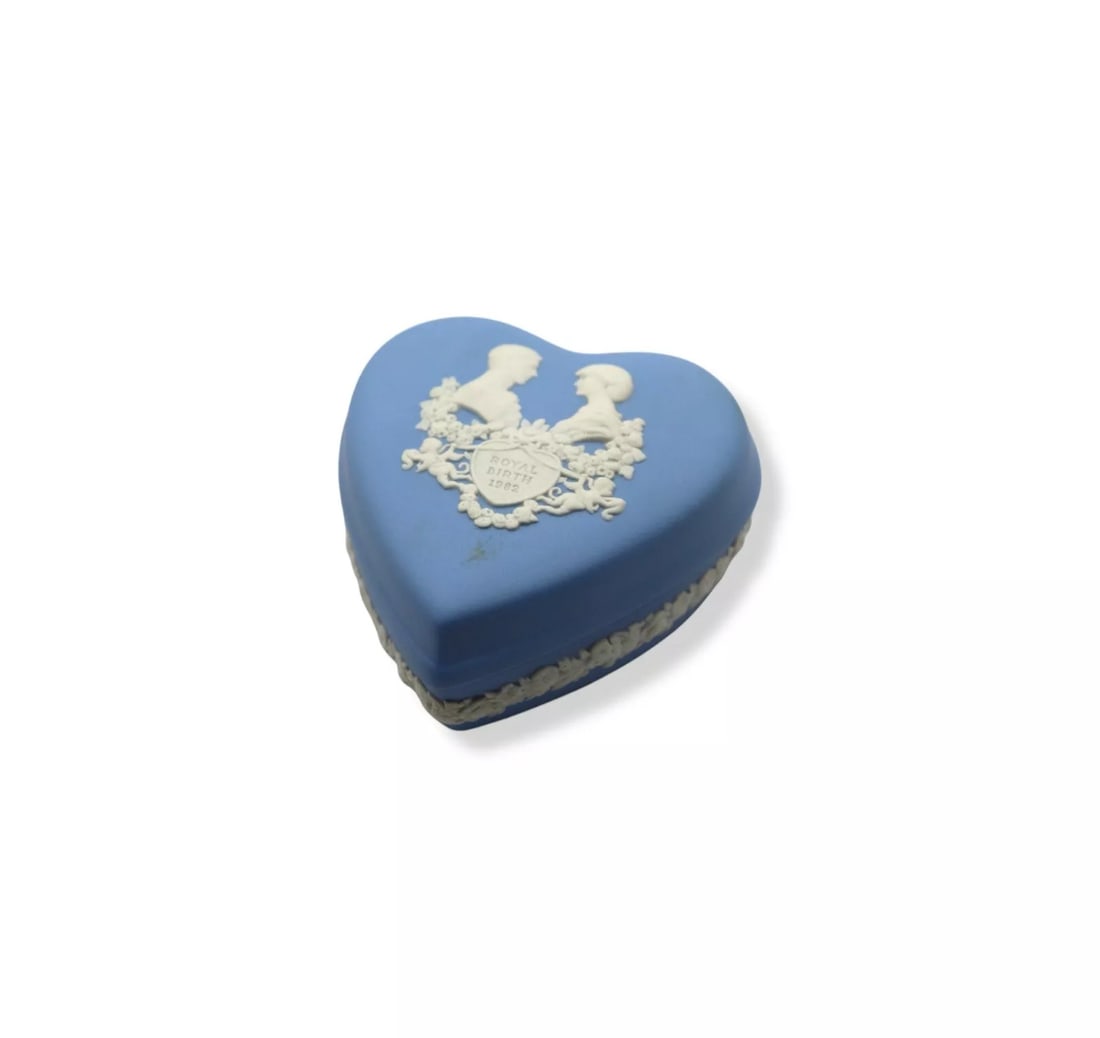 Wedgwood Cream Color on Pale Blue Jasperware Diana & Charles Heart Trinket Box: Wedgwood Cream Color on Pale Blue Jasperware Diana & Charles Royal Birth Heart Trinket Box, commemorating the 1982 royal birth with a delicate relief design. Measuring 2 5/8 inches wide, this heart-sh