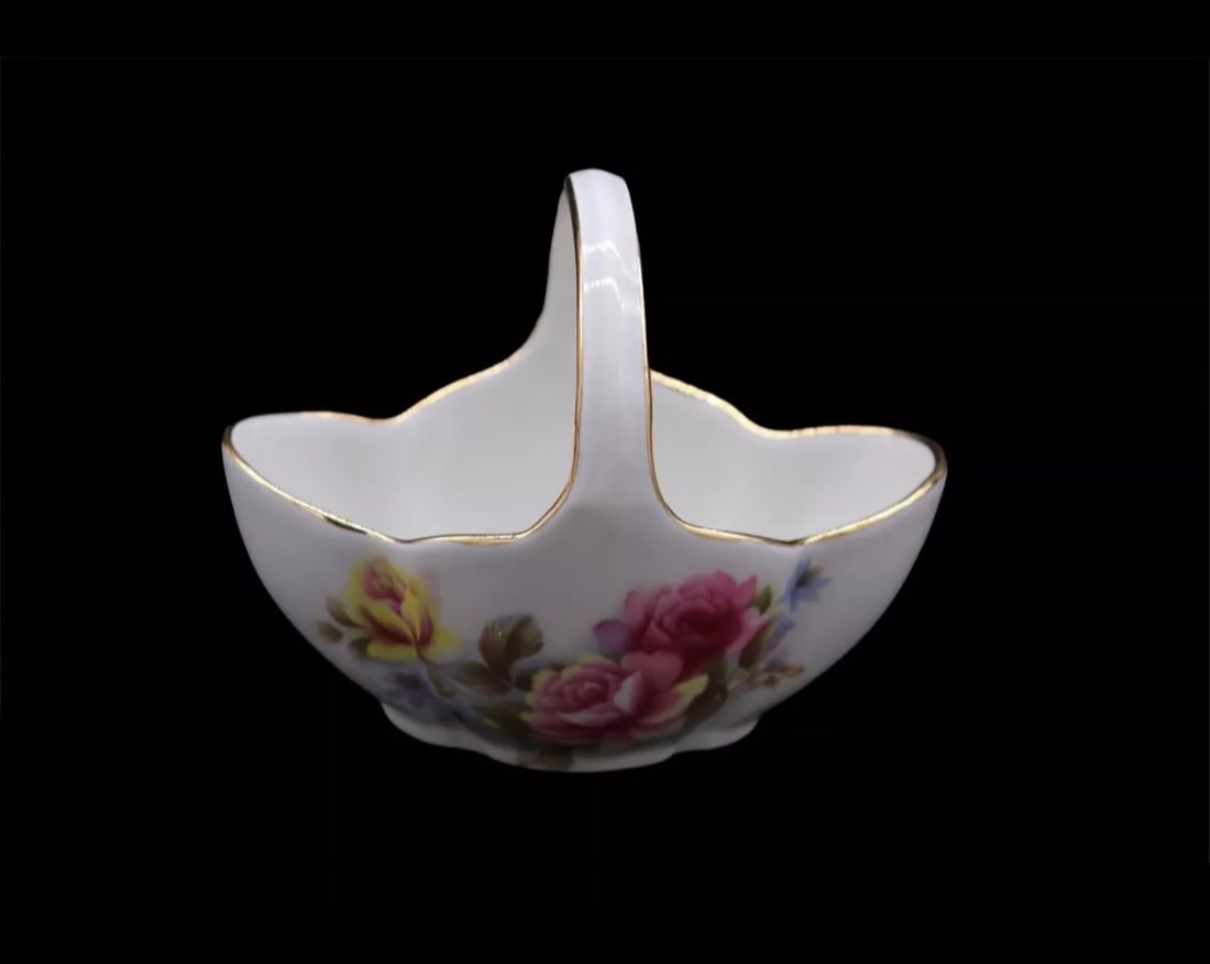 Vintage Limoges France Porcelain Flower Basket: Lovely little Limoges France porcelain flower basket with beautiful hand painted floral pattern and gold gilded scalloped rim. This piece is in excellent vintage condition with no chips, scratches or 