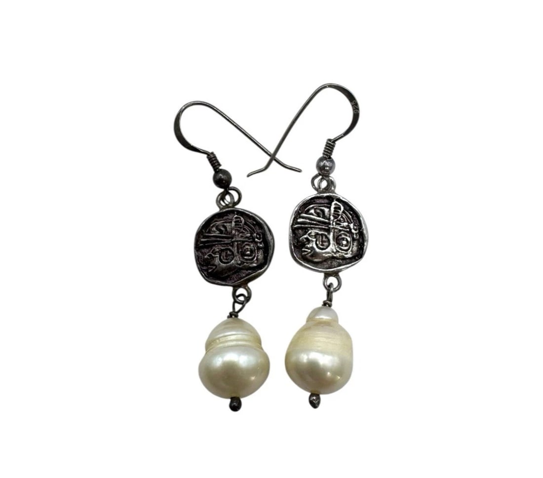 Vintage Sterling Silver Ancient Aztec Coin Replica W/ Pearl Drops Earrings: These Vintage Sterling Silver Ancient Aztec Coin Replica Earrings feature pearl drops as the main stone, adding a touch of elegance to any outfit. The earrings are crafted from high-quality 925 sterli