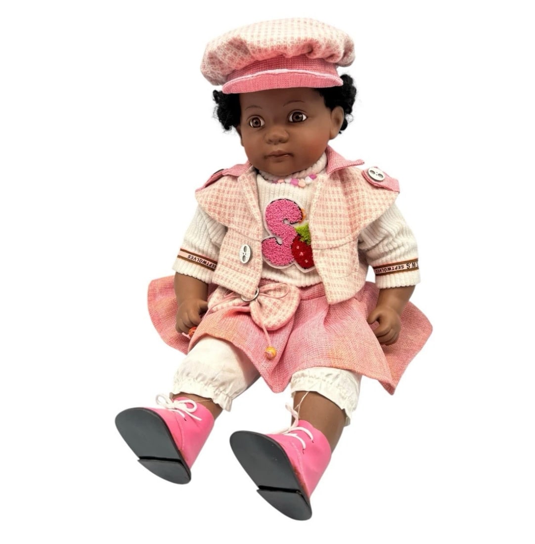 Vintage Golden Keepsakes African American Baby Girl Doll: The Vintage Golden Keepsakes African American Baby Girl Doll is a 23-inch doll designed by the artist Golden Keepsakes. This particular doll is part of the American Girl franchise, featuring an Africa