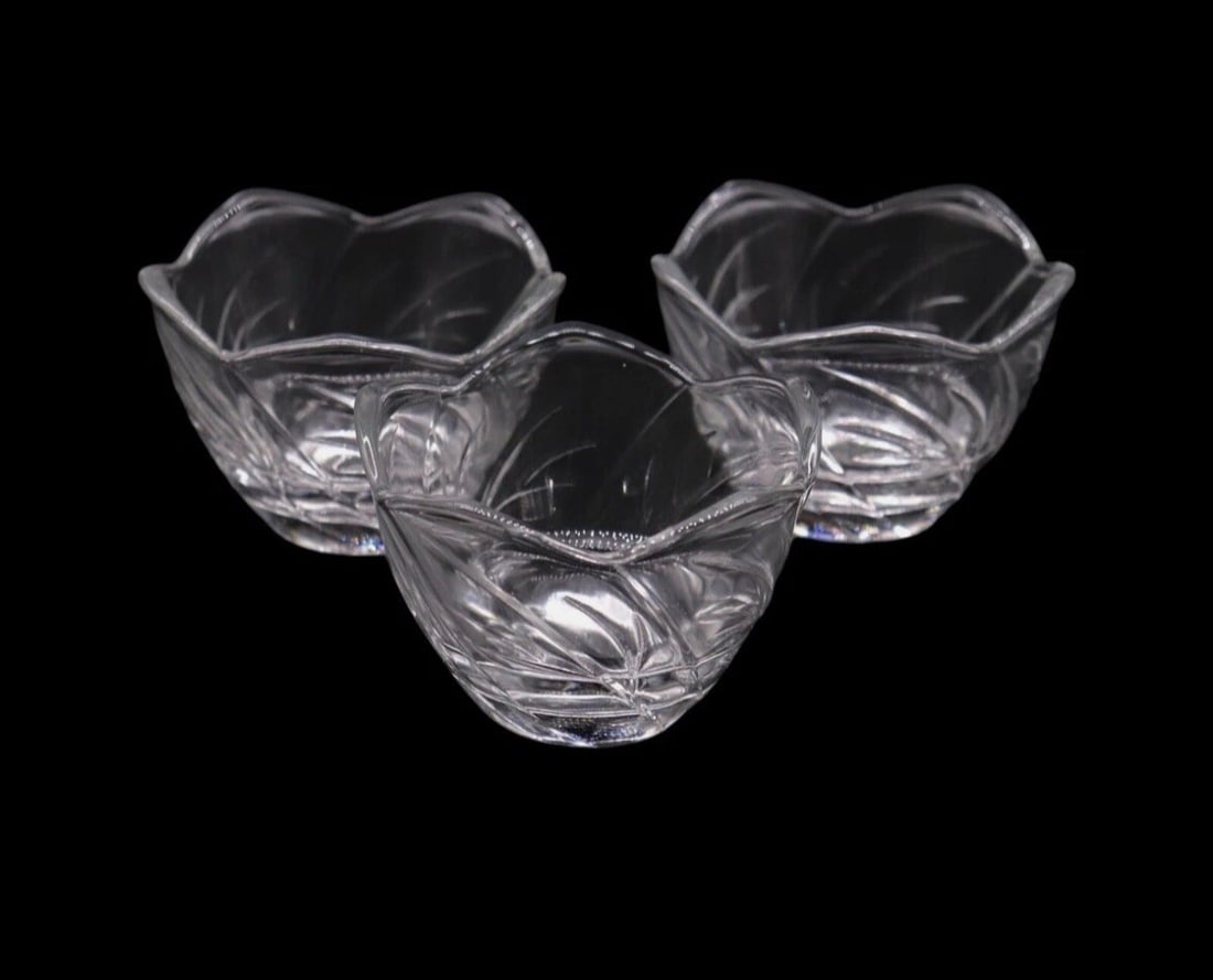 (3) Vintage KIG Indonesia Clear Glass Lotus Dessert Cups: Set of 3 vintage KIG Indonesia clear glass lotus dessert cups in excellent condition. Each cup features an elegant lotus flower design with a smooth finish, perfect for serving desserts or as decorati