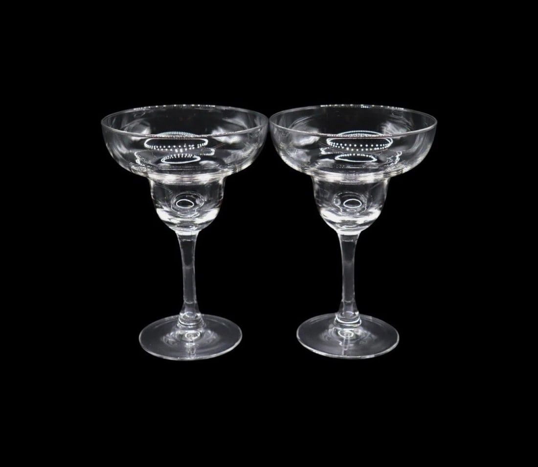(2) Mid-Century Modern Style Clear Margarita Glasses: Mid-Century Modern Style Clear Margarita Glasses – Set of 2, each standing 6 3/4 inches tall. Featuring a sleek design with a wide, rounded bowl and elegant long stem, these glasses are perfect for