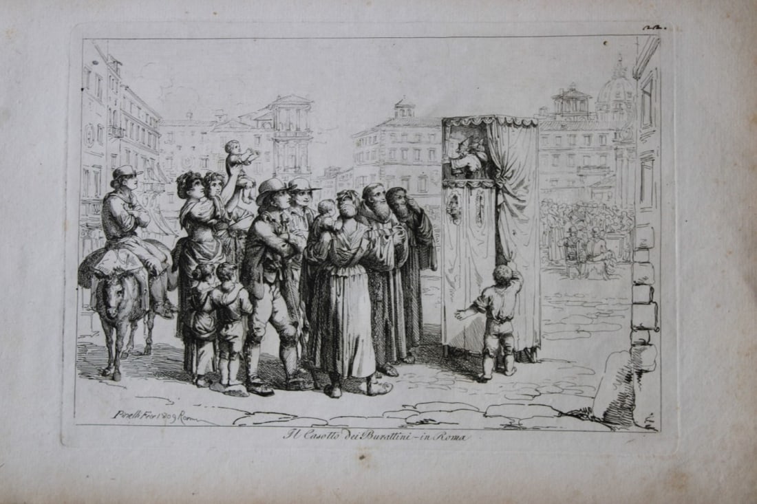 Il Casotto dei Burattini in Roma by B Pinelli from Costumi Pittoreschi 1809: This etching is from Raccolta di Cinquanta Costumi Pittoreschi incisi all acqua forte da Bartolomeo Pinelli Romano. Published by Lorenzo Lazzari, Rome 1809.This plate is entitled: Il Casotto dei Burat