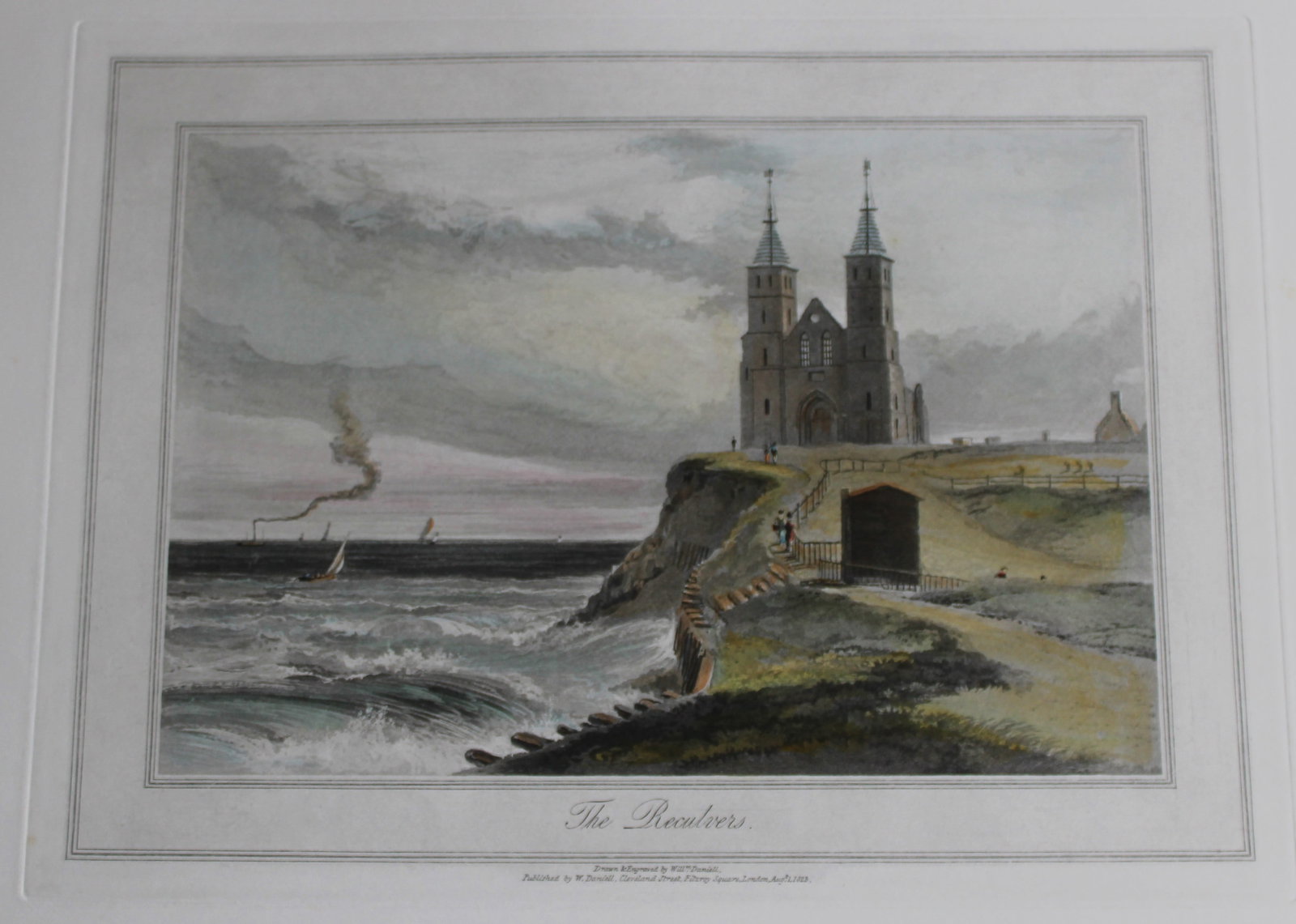 W Daniell - The Reculvers c1820: This engraving is from A Voyage Round Great Britain by William Daniell. Printed by Longman, Hurst, Rees, Orme and Brown, London, 1814-25. Hand-coloured aquatint from this work were drawn Daniell and e