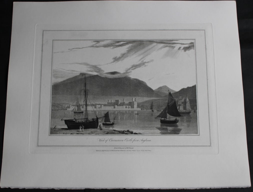 W Daniell - Caernarvon Castle from Anglesea c1820: This engraving is from A Voyage Round Great Britain by William Daniell. Printed by Longman, Hurst, Rees, Orme and Brown, London, 1814-25.The engravings in this work were drawn Daniell and engraved by 