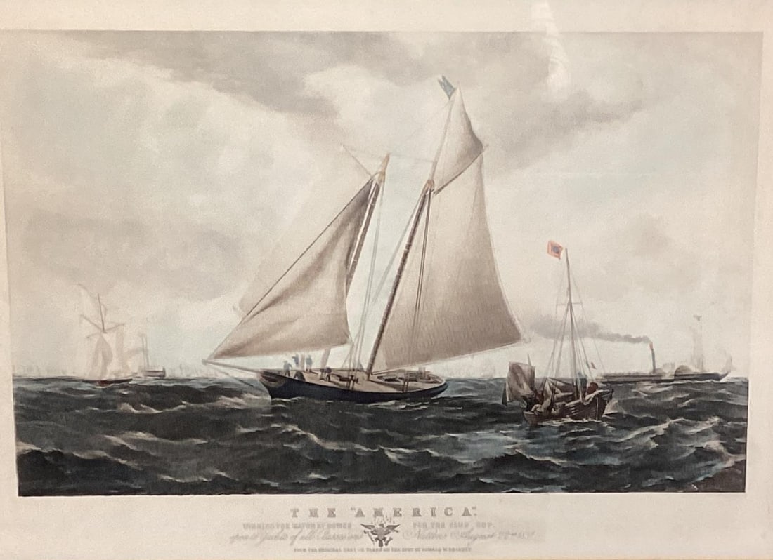 The America yacht by Thomas Goldsworth Dutton 1851: This artwork is a 19th-century colourful lithograph by Thomas Goldsworth Dutton, based on a scene depicting Oswald Walters Brierly's yacht America winning the Cowes Cup in 1851. Publication: London: A