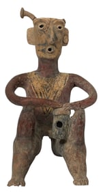 Male Figure Playing A Drum